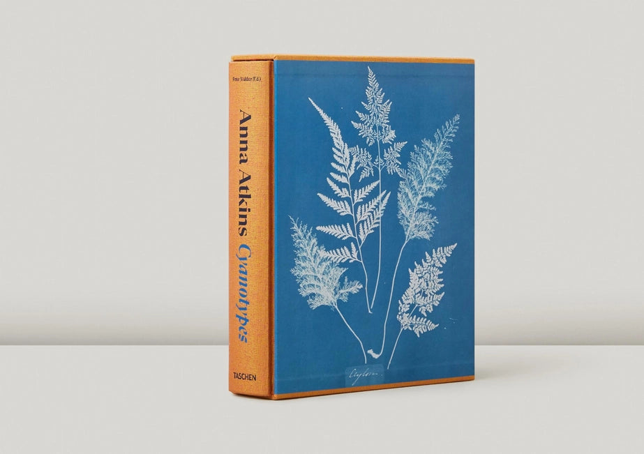 An angled view of the binding and front cover of a book titled Cyaotypes.