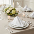 White napkin with a folded corner on a black background