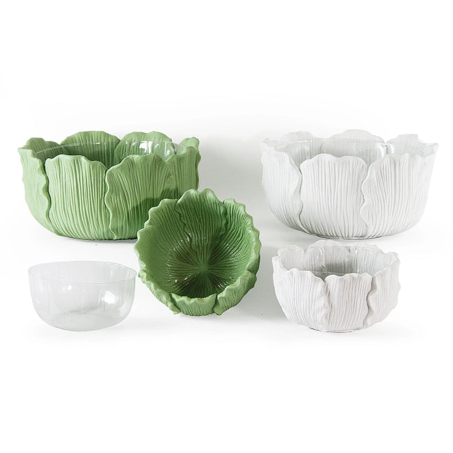Set of green and white ceramic bowls with textured surfaces on a white background