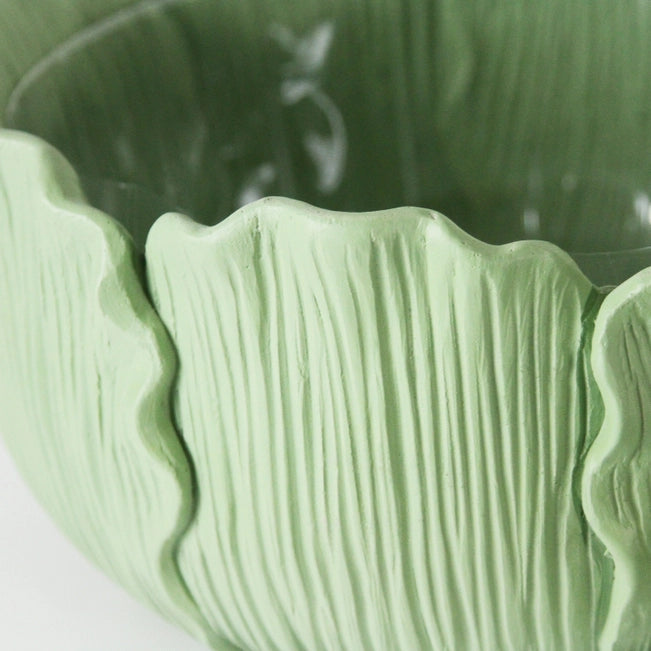 Close-up of a textured green ceramic bowl